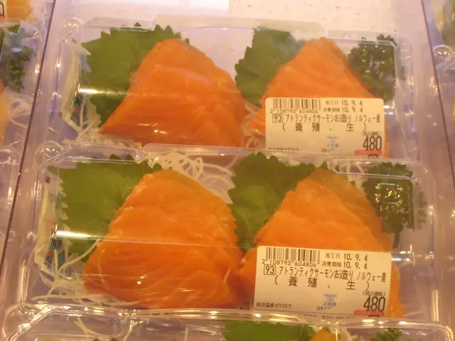 In this image we can see there are slices of fish packed in a plastic bag.