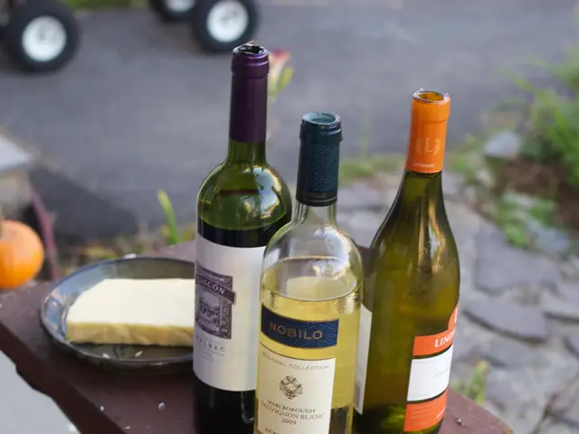 In this picture we can see three bottles of two in green color and one in golden color and a bowl...