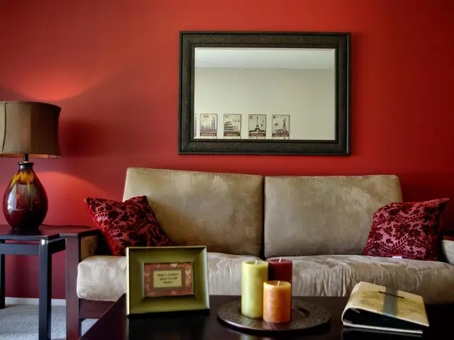 In the middle it's a sofa behind it a wall.