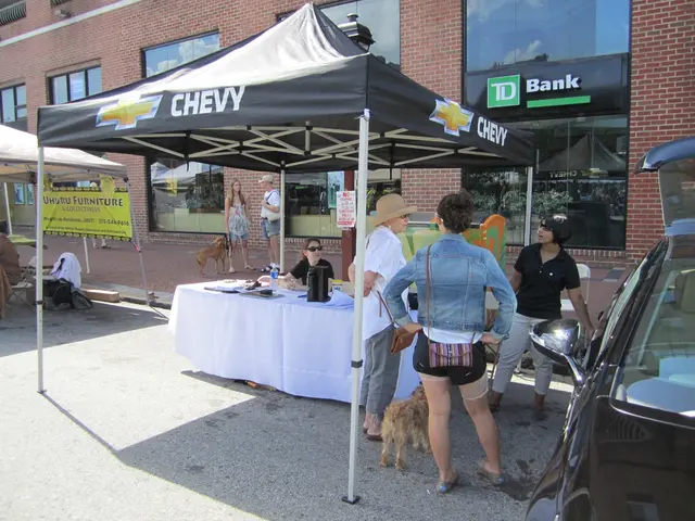 In the image we can see there are people who are standing with their dogs and on the table there...